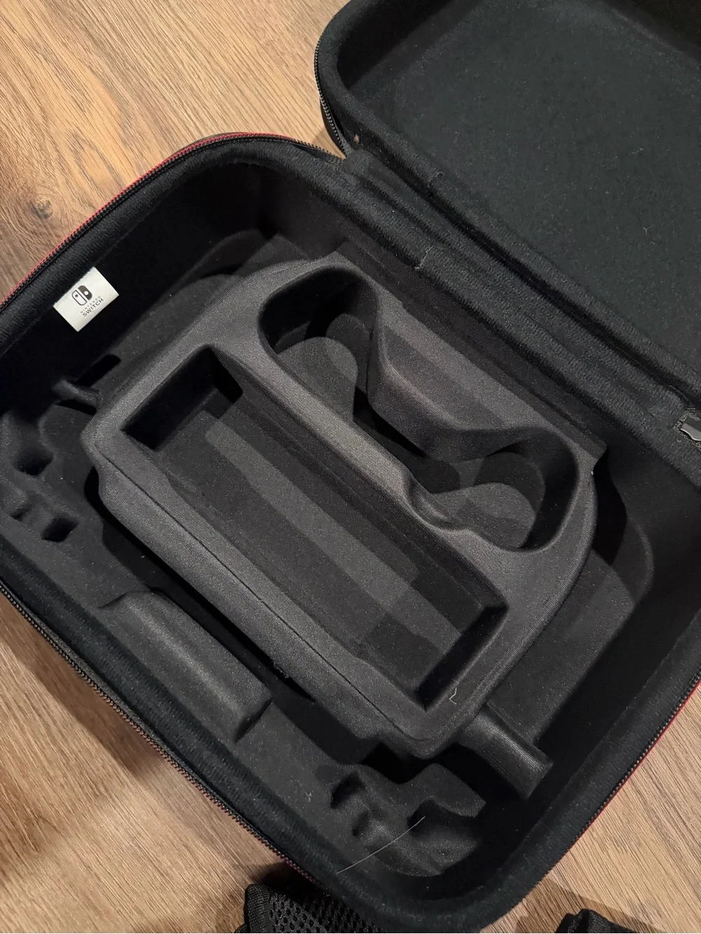 Nintendo Switch Black Carrying Case with Red Accents & accessories